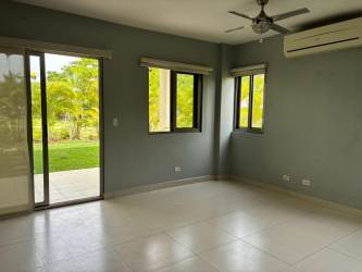 Fenced backyard garden with lawn and plants in duplex house rental Panama Pacifico Veracruz