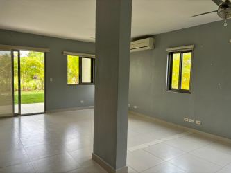 Outdoor community swimming pool with sun deck at Panama Pacifico Veracruz residential