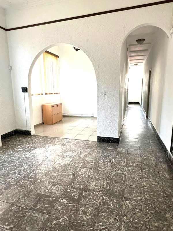 Bright entry hall with arches and windows Perejil Business Center Panama City