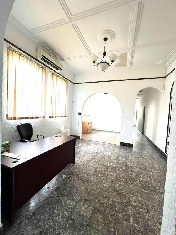 Reception area with desk and chairs in Perejil Business Center Panama City