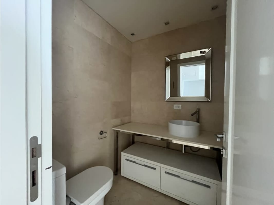 Spacious walk-in closet with built-in shelves in master bedroom of PH Yoo Panama