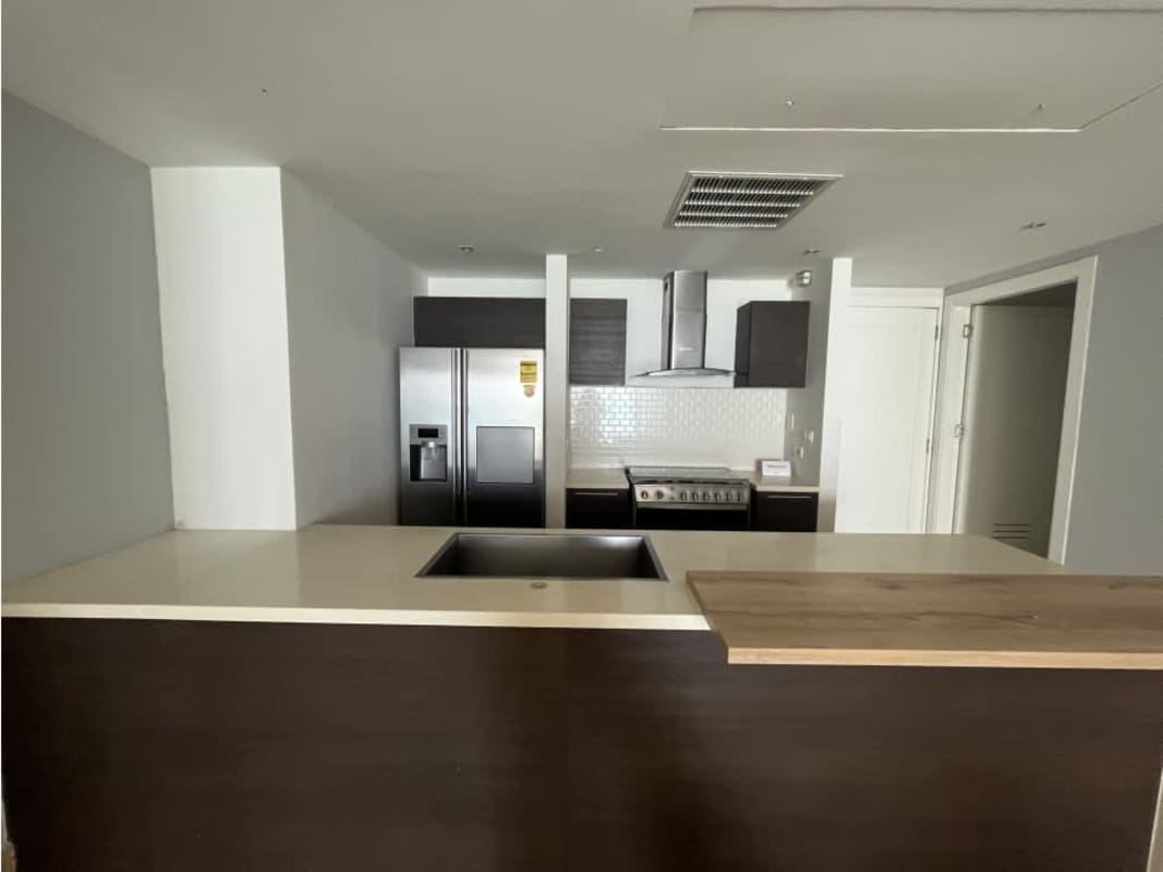 Fully equipped luxury kitchen with island and stainless steel appliances at PH Yoo Panama