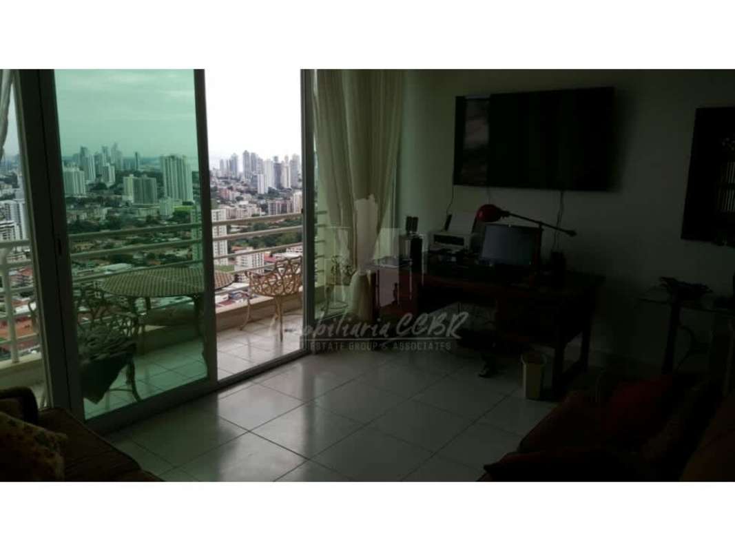 Spacious living room with tile floors and balcony with panoramic city view PH Vivendi Edison Park Panama City
