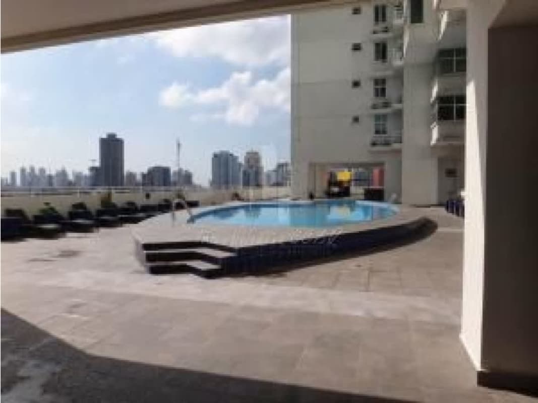 Bedroom with large windows offering city skyline view in PH Vivendi 300 Panama City