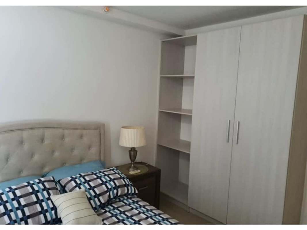 Outdoor pool area with palm trees and lounge chairs at PH Sky Park Panama