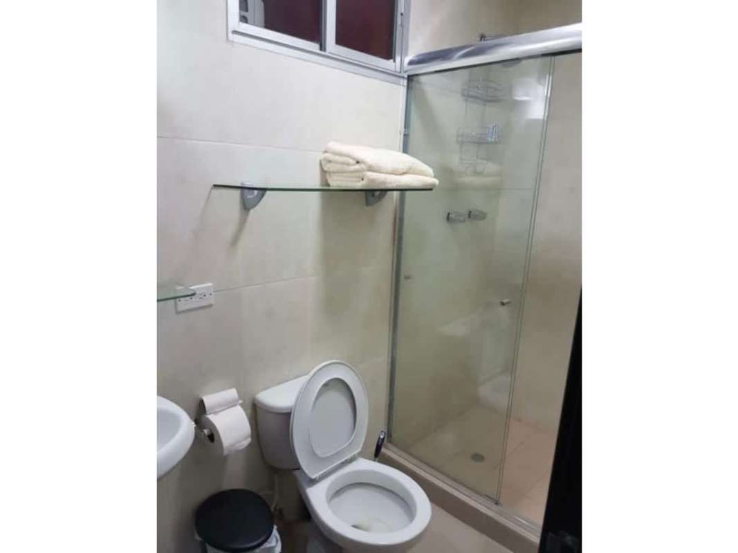 Modern bathroom with glass shower enclosure and white fixtures PH Sky Park Panama