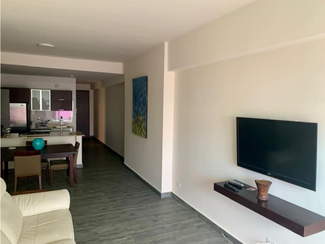 Modern kitchen with granite counters and stainless appliances in PH Element apartment Panama City