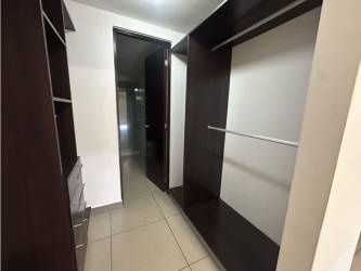 Kitchen with granite countertops, stainless appliances, dark wood cabinetry in PH Mosaic Panama Pacifico