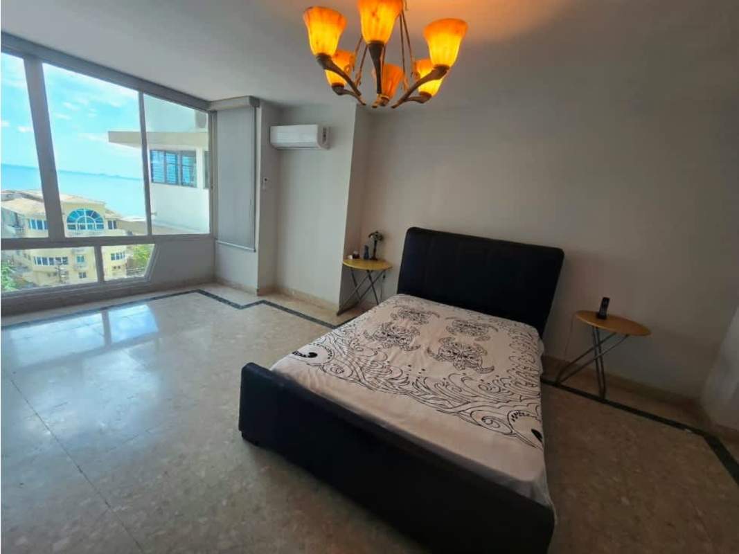 Spacious bathroom with marble surfaces, large mirror, tub in PH Tamanaco Punta Paitilla Panama