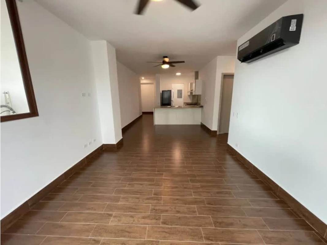 Bright living room with ceramic floors connected to kitchen apartment PH Costamare Panama