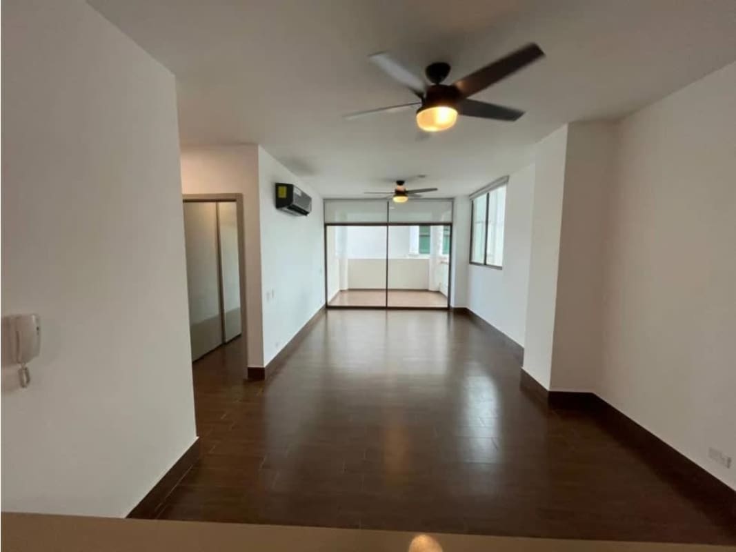 Open kitchen with breakfast bar, gas stove, modern cabinets in Costa Sur apartment Panama