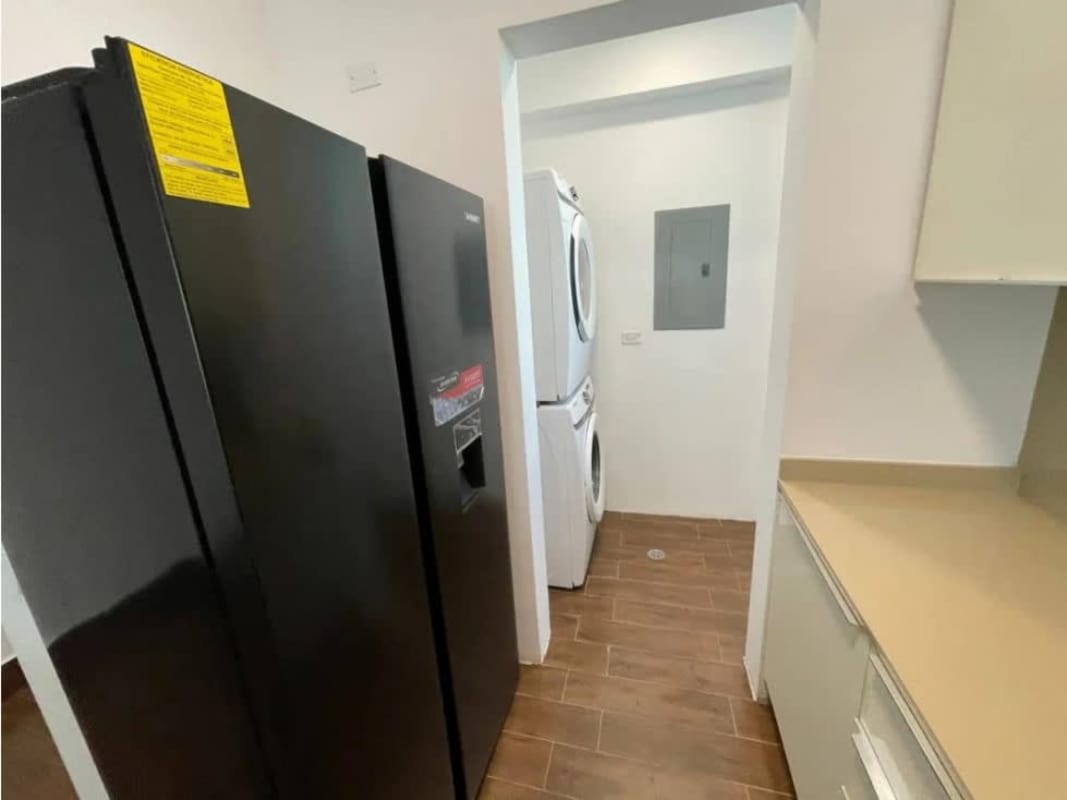 Master bedroom with large window garden views apartment at PH Costamare in Costa Sur Panama