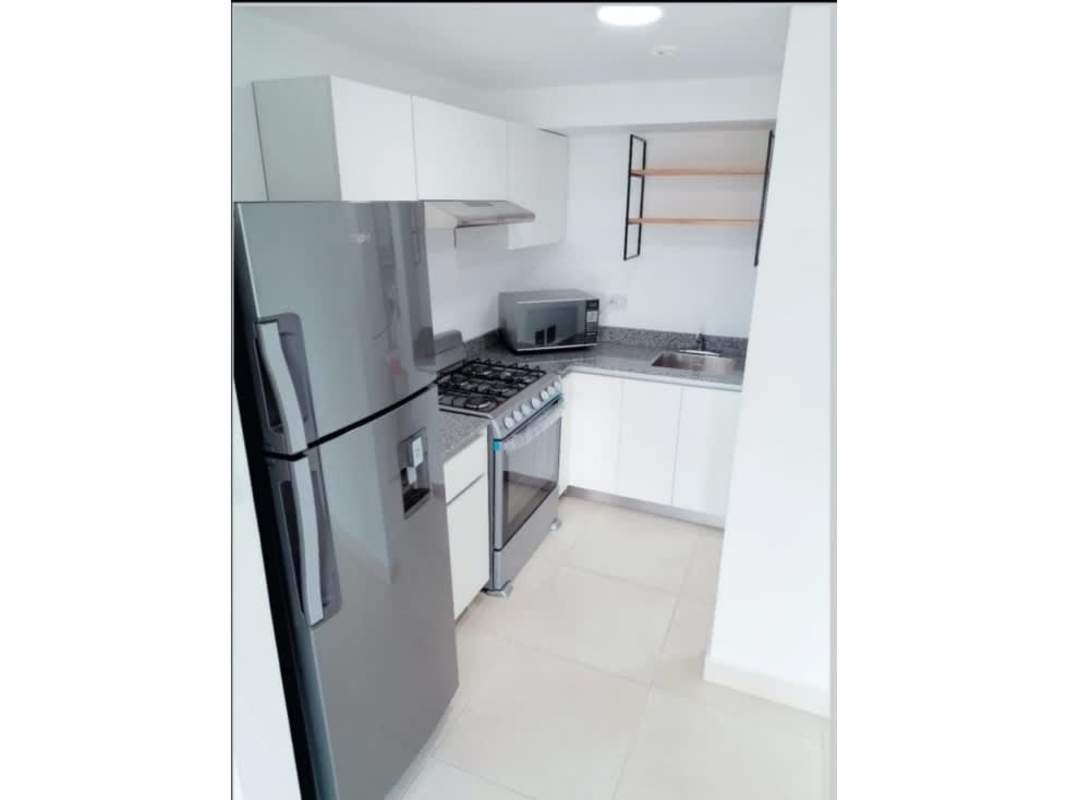 Kitchen with granite counter, stove, microwave, fridge in PH Panamá Residences Panama City