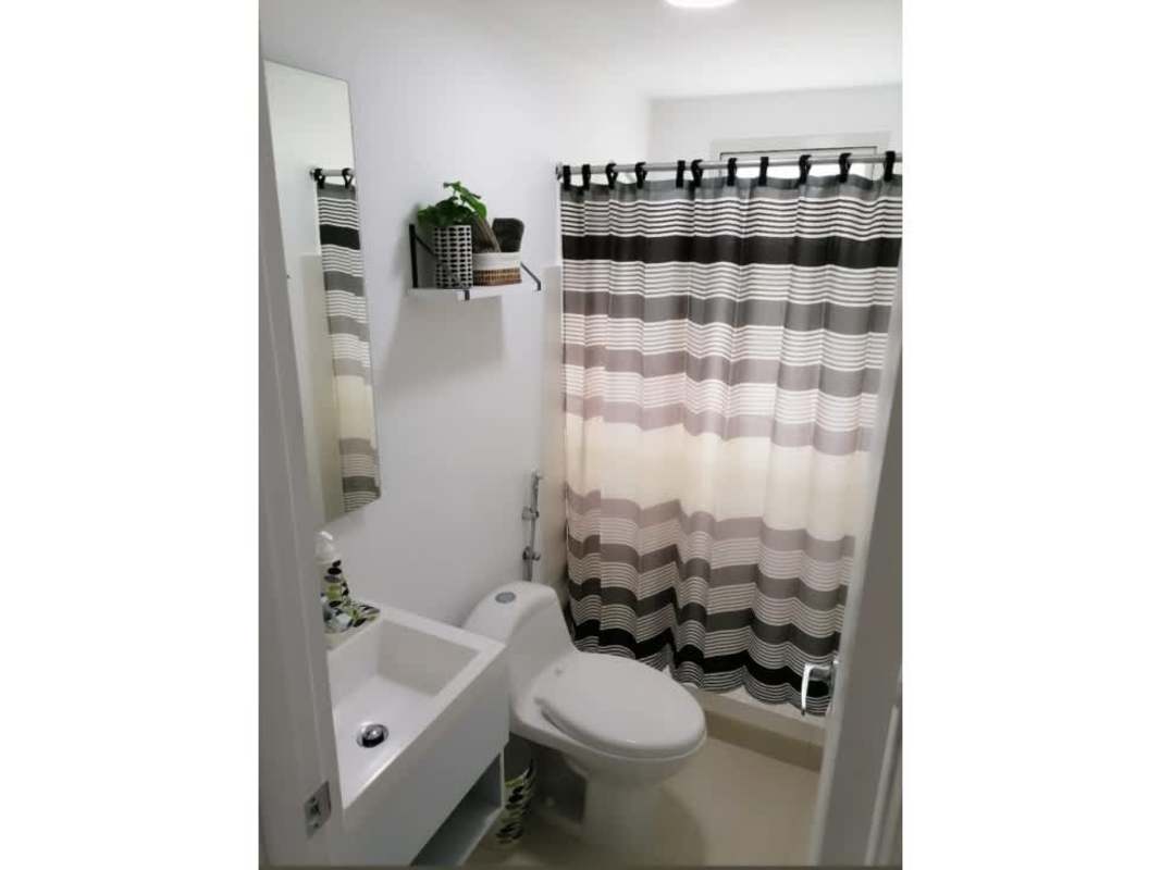 Compact bathroom with shower, sink, toilet PH Panamá Residences Panama City