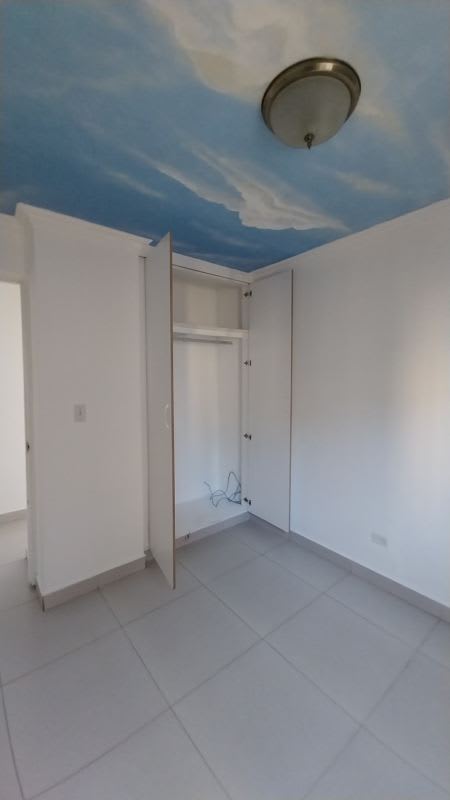 Kitchen with granite countertops and wooden cabinets in PH Condado Country Club Condado del Rey Panama