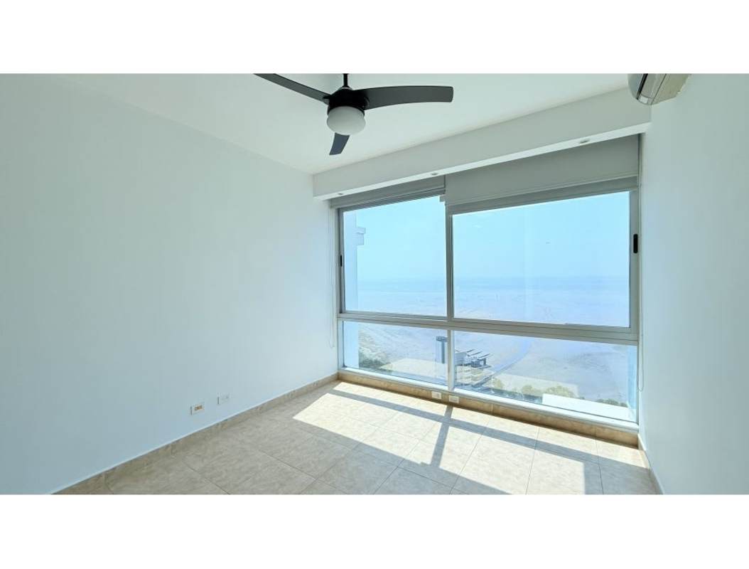 Bright master bedroom with floor-to-ceiling windows panoramic ocean views Costa del Este Panama City