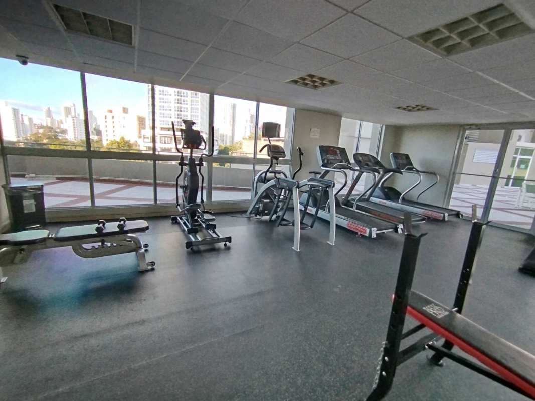 Workout room with weights and cardio machines at PH Hyde Park close to Parque Omar Panama