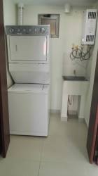 Covered parking area with landscaping PH Midrise Panama Pacifico