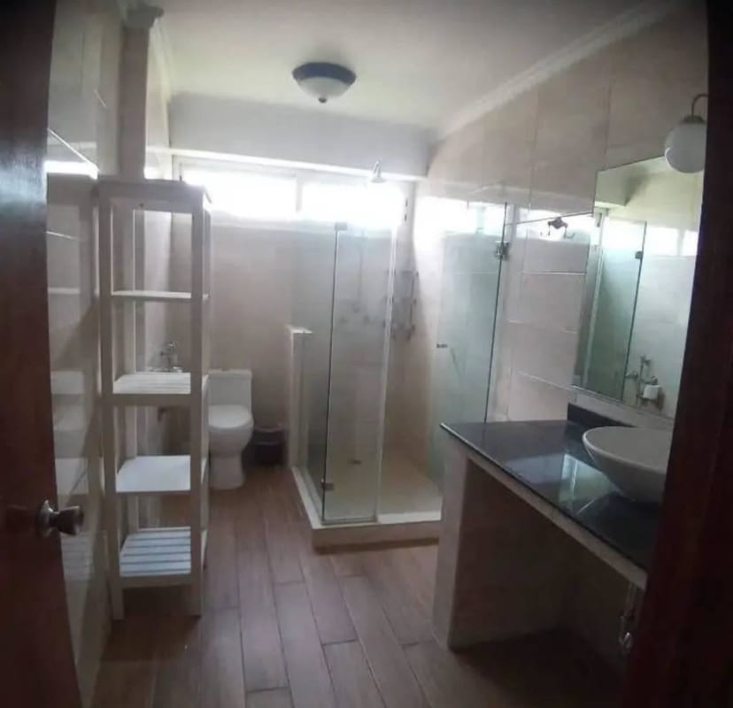 Modern kitchen with hexagonal tile grey cabinets farmhouse sink PH La Cresta Bella Vista Panama