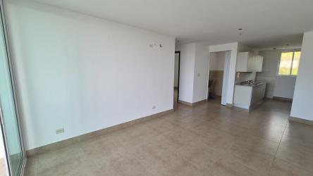 Bright open plan living and kitchen area with large window ceramic floors in beach condo PH Playa San Carlos Panama