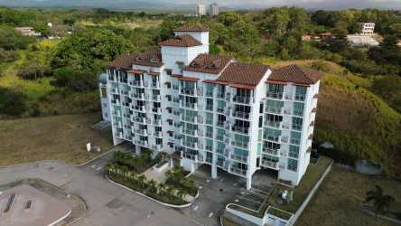 Mediterranean style mid-rise condo with balconies and terracotta roof beach community in Panama