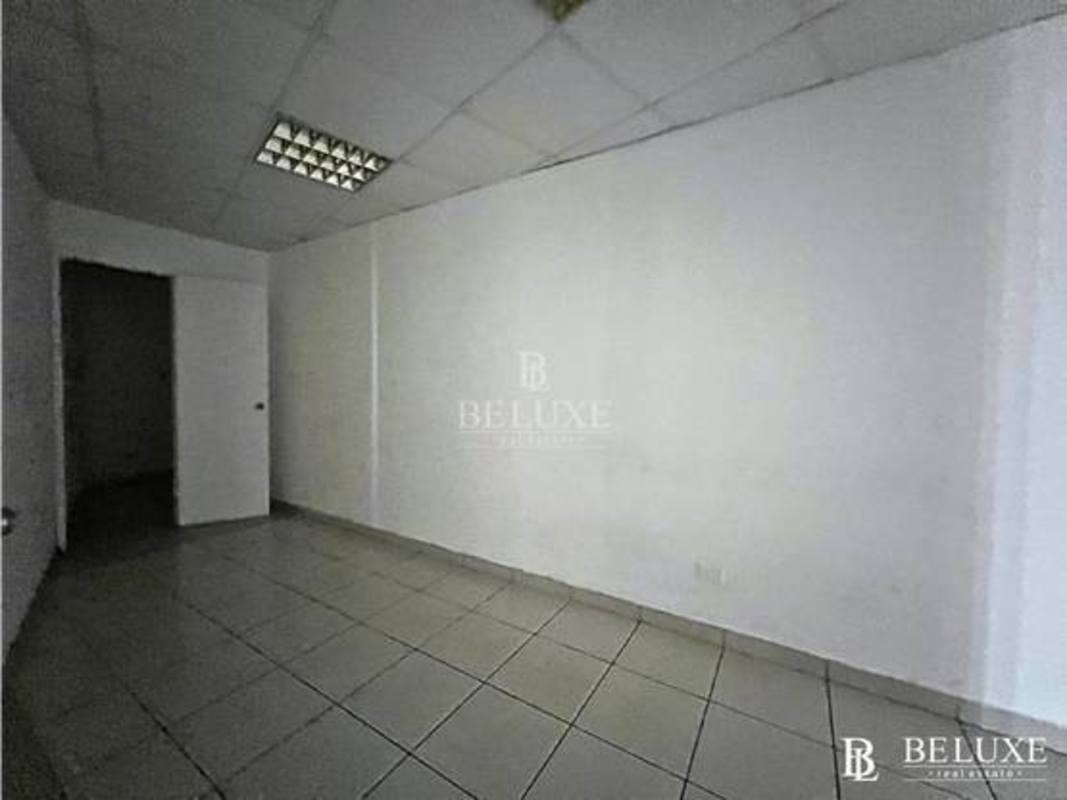 Compact kitchenette with cabinets and sink inside office Torre Generali Obarrio Panama