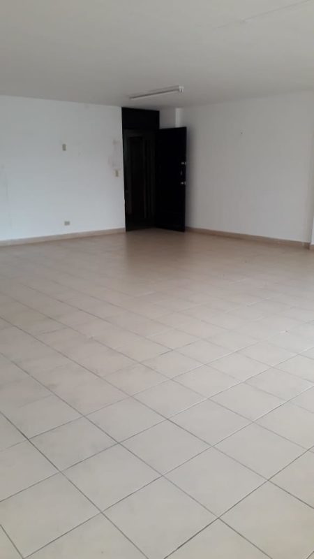 Multi-story commercial office building with balconies and storefronts on Vía Argentina Panama City