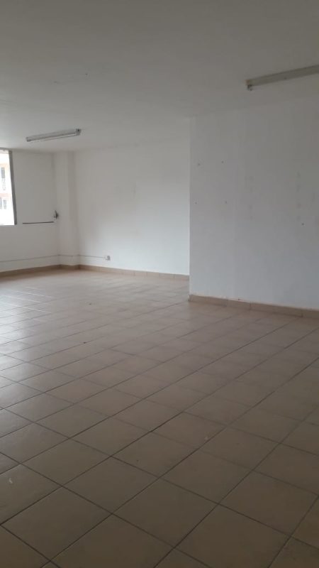 Interior corridor of office space with white walls, tile flooring in PH Bella Vista Office Center Panama City