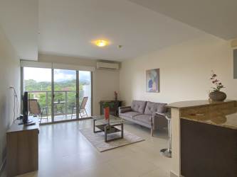 Modern bathroom with glass shower enclosure and sleek vanity in rental Panama Pacifico