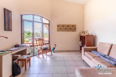 Bright bathrooms with walk-in showers, tile walls in David Panama condo