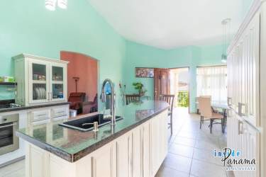 Spacious living area with large window, tile floor and terrace in modern condo David Panama