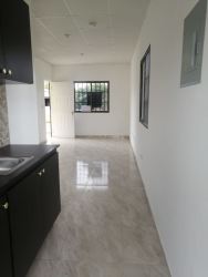 Bathroom with pedestal sink, tiled shower and white fixtures in affordable single-family home Rio Hato Panama