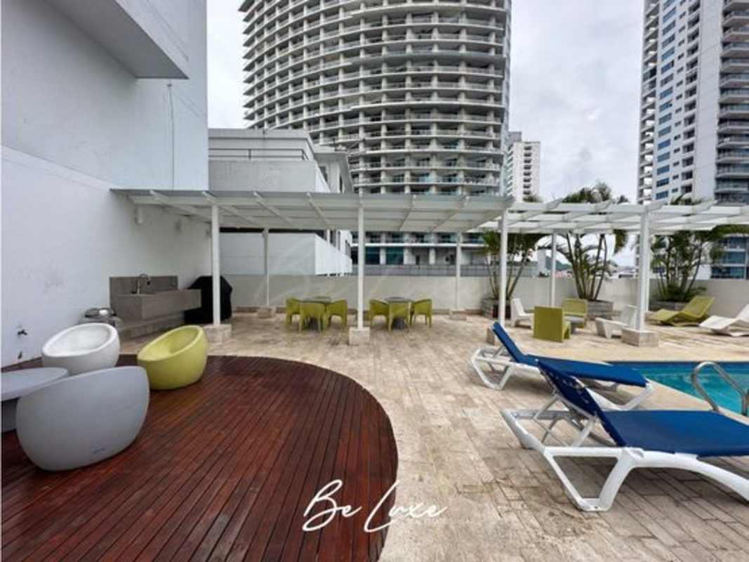 Bright dining area with panoramic glass windows and balcony in Sky Residences Panama City