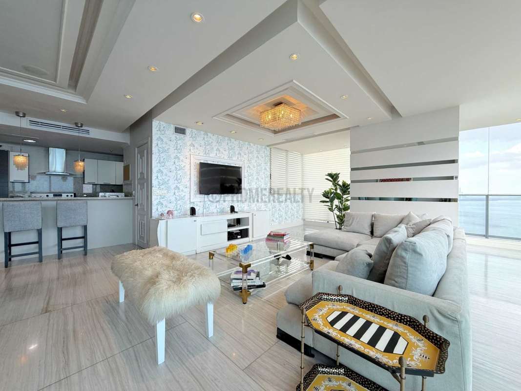 Modern kitchen with granite countertops and bar at Trump Ocean Club