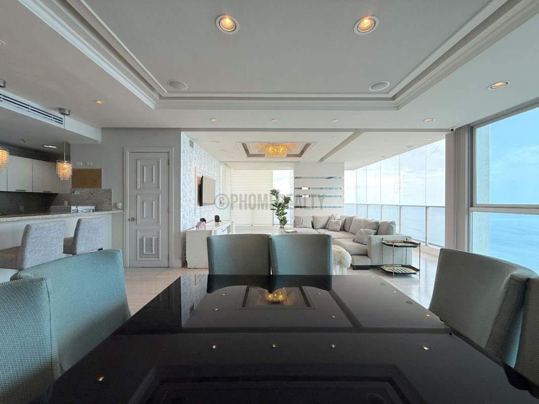 Open plan living dining with floor-to-ceiling windows Panama luxury rental