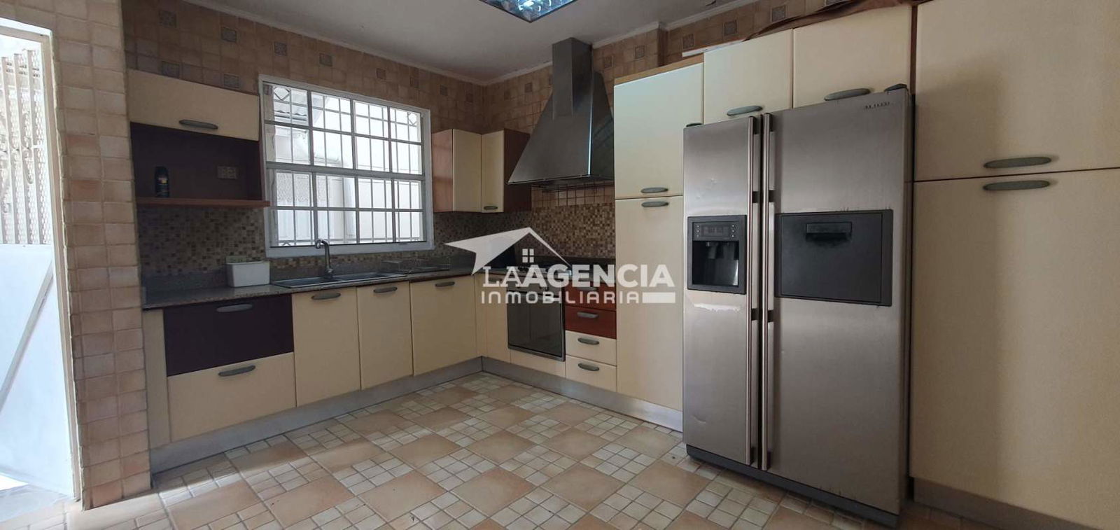 Covered terrace overlooks fenced private garden lawn Residencial Altos del Bosque Panama