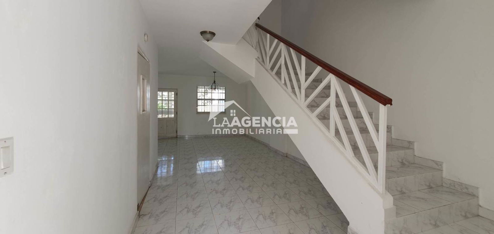 Spacious living dining area porcelain tiles ceiling fan in house at Residencial El Doral Panama