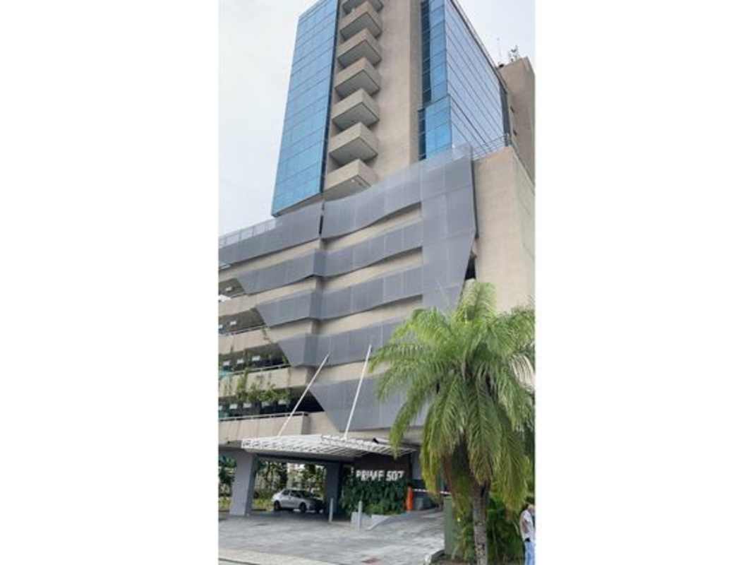 Modern glass-clad office tower next to land for sale in Santa María Panama