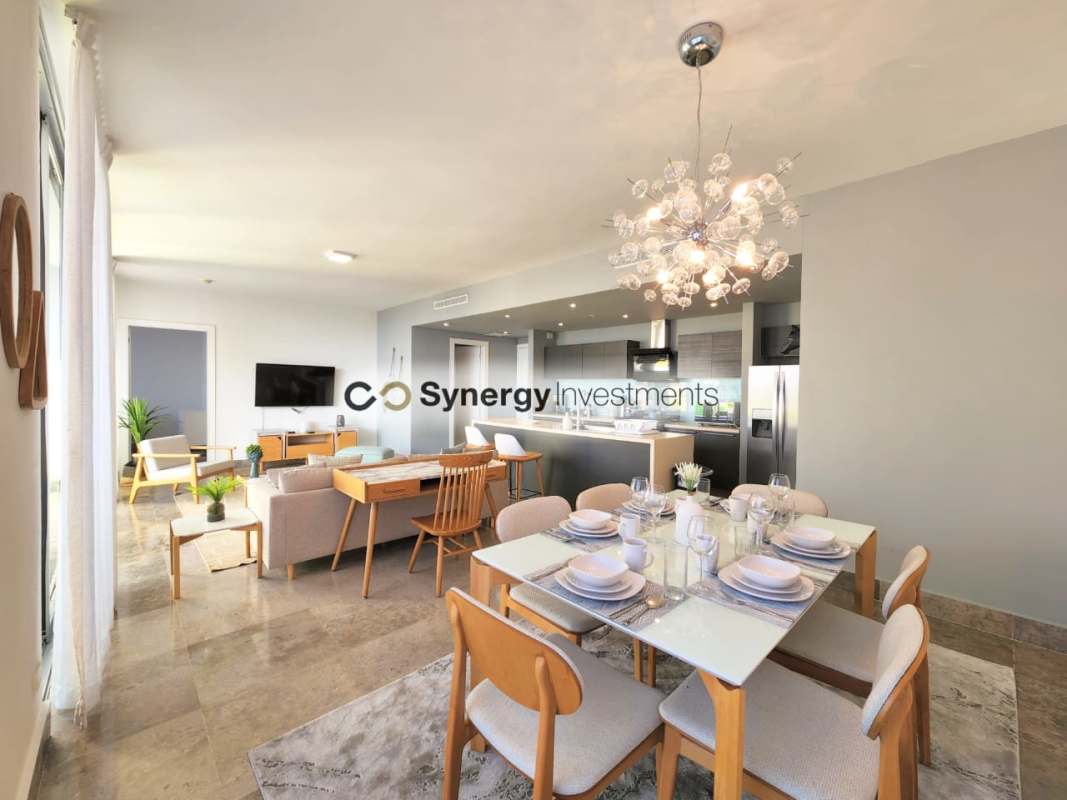 Open plan living and dining with floor to ceiling windows city skyline view Yoo Panama