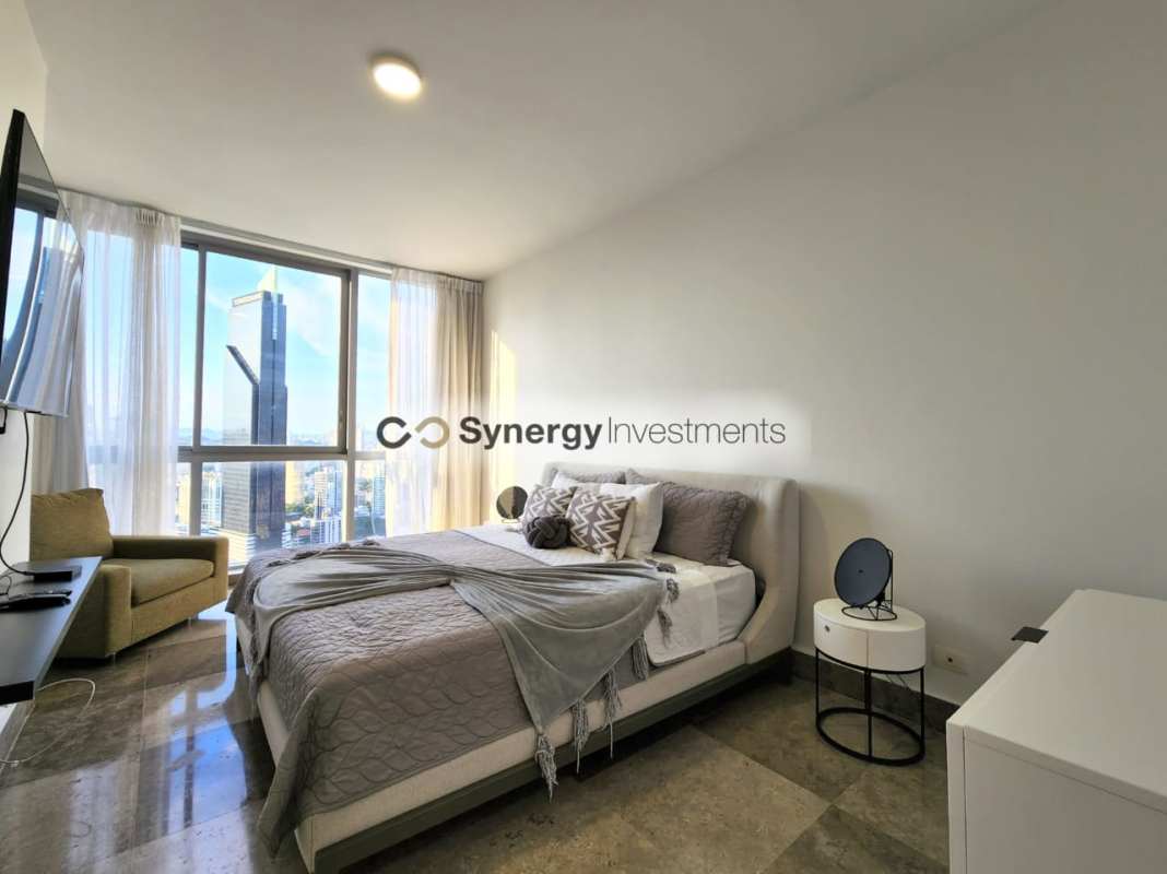 Luxury master bedroom with large windows panoramic skyline view Yoo Panama Avenida Balboa