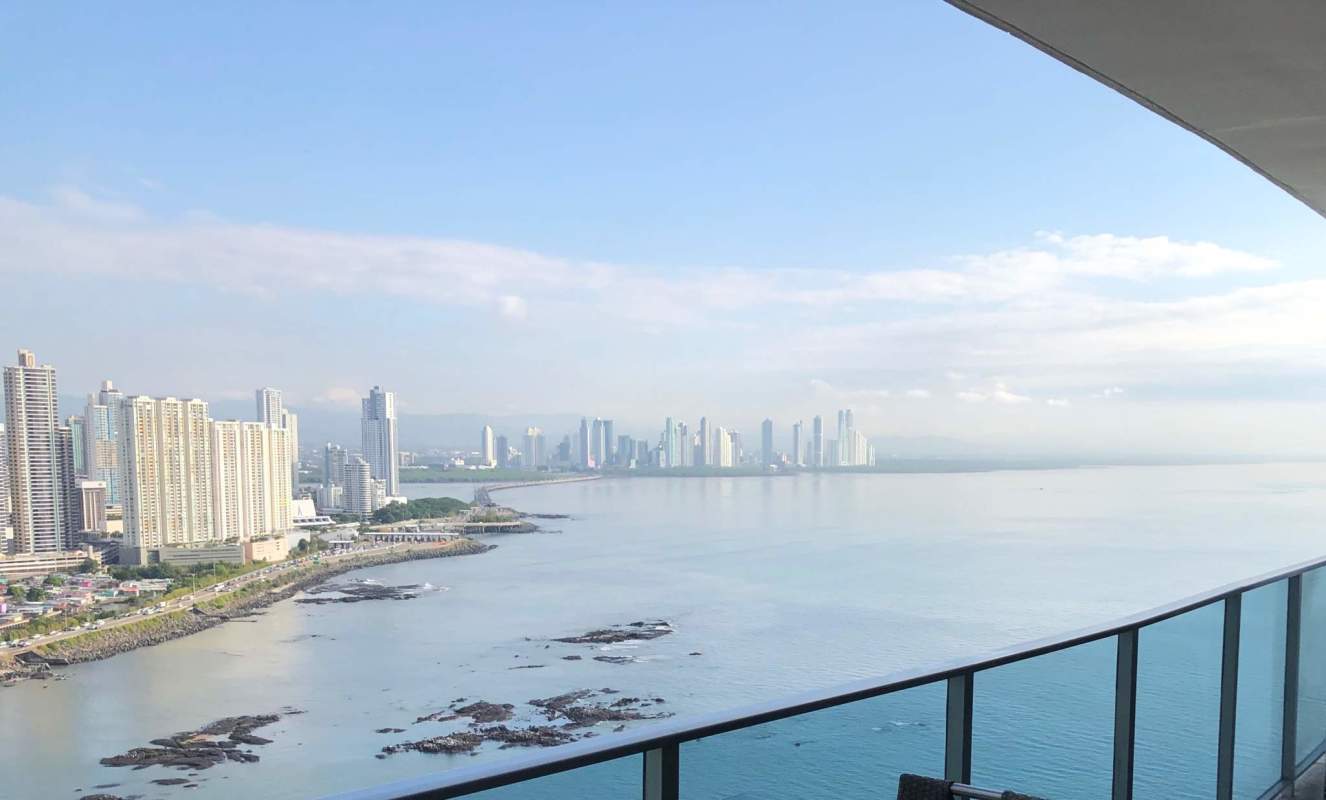 Bright living area with large windows and ocean skyline views in Punta Pacifica Panama