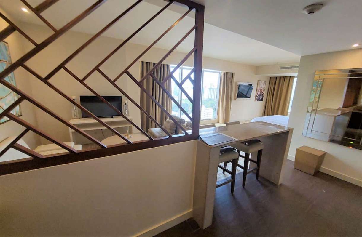 Modern bathroom with rain shower and marble countertop vanity in PH Waldorf Astoria residence Panama