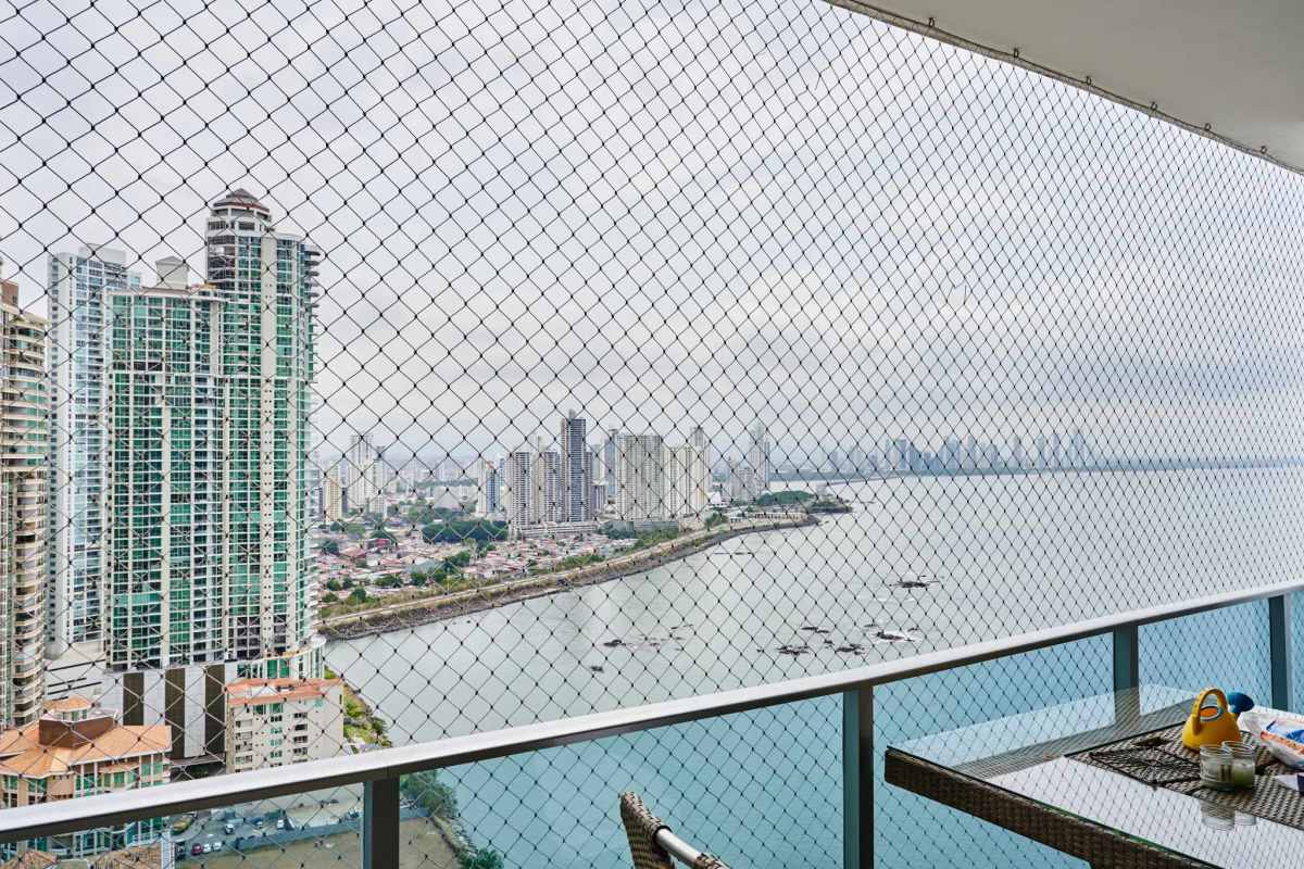 Spacious master bedroom in Grand Tower Punta Pacifica offering ocean and city skyline views