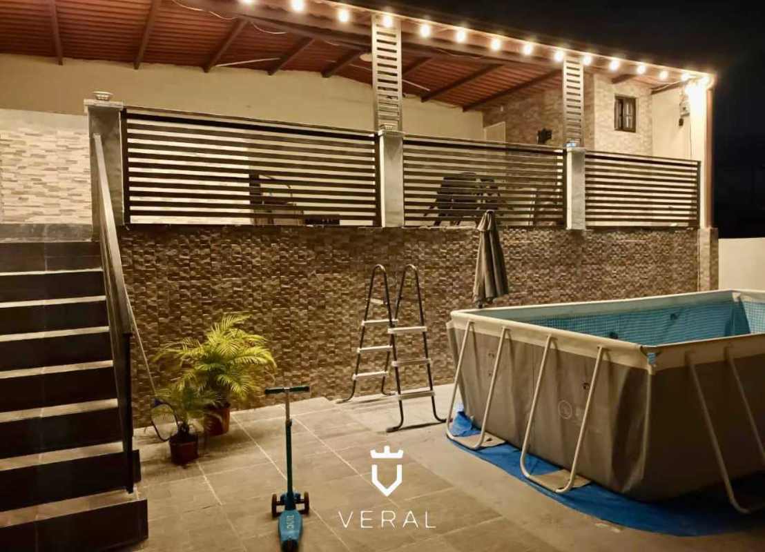 Private backyard entertainment space with covered patio at PH Vistas del Lago Las Cumbres Panama