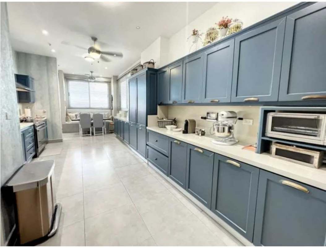 Private terrace with glass railing overlooking Pacific Ocean and city skyline at PH Marea Panama City