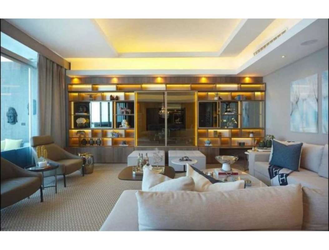 Modern closed kitchen with granite countertops stainless appliances in PH Marea Costa del Este