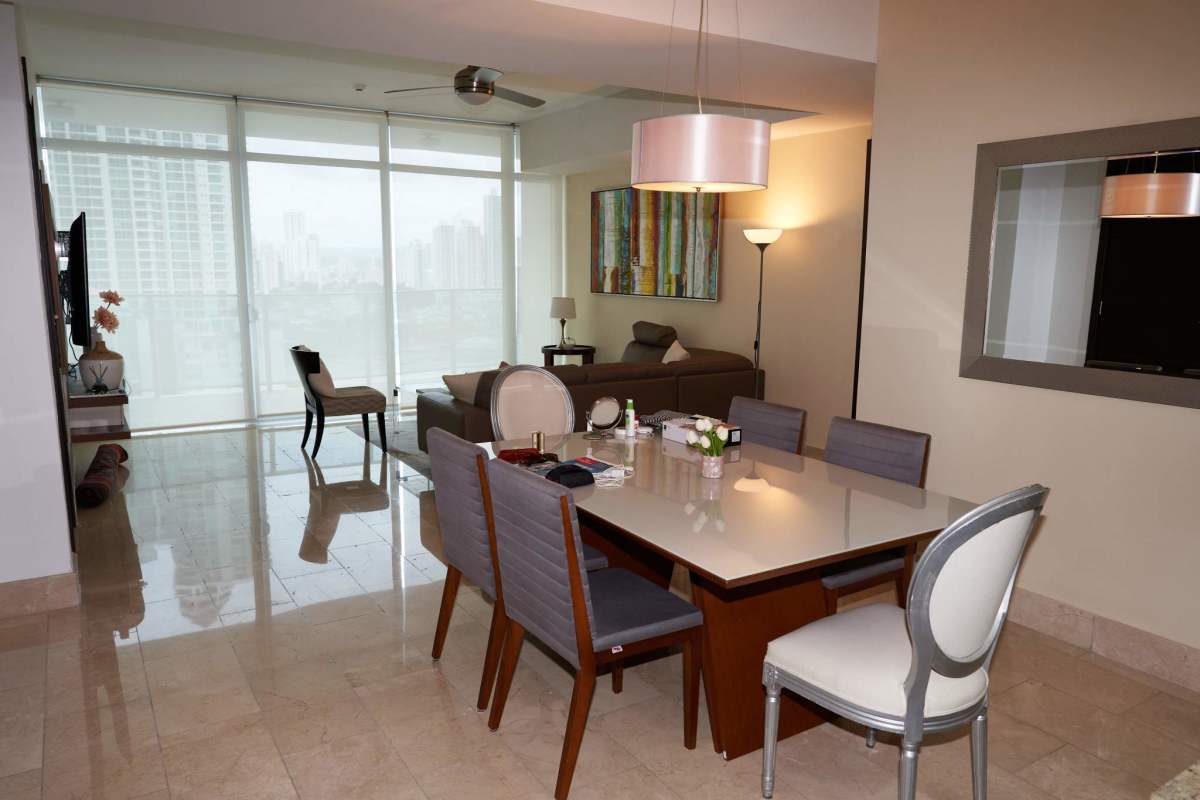 Elegant bathroom with glass shower and stone countertop in Grand Tower Panama City