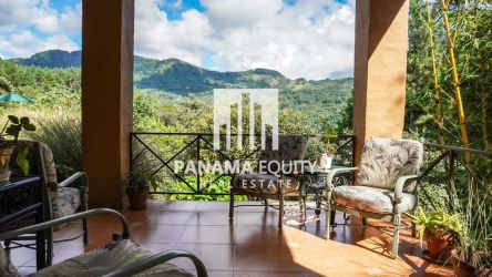 Dining room with large windows, natural light, tropical decor Villa Valencia mountain home Panama