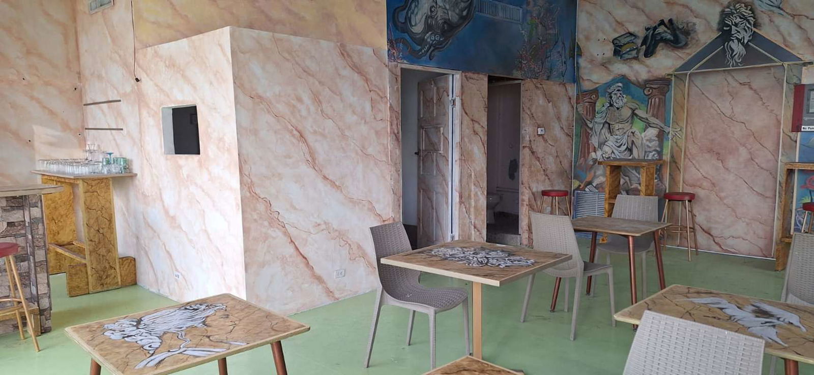 Art-inspired interior with marble walls, counter, and seating at PH Vista del Mar commercial space Panama City