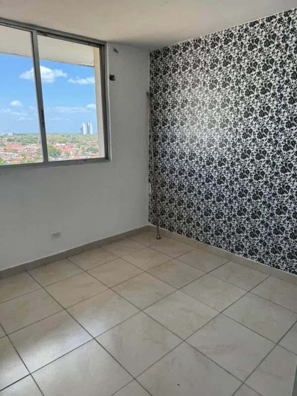 Empty bedroom with accent wallpaper, large window and city view Mystic Tower Panama City